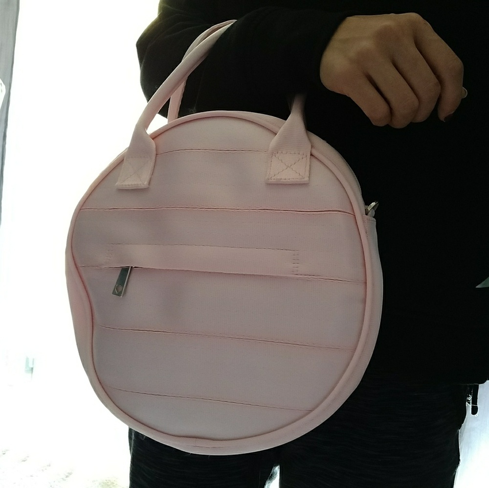 Harvey CA Pink circle handbag with crossbody strap